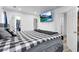 Spacious bedroom with neutral walls, walk in closet, and modern television at 5357 Beaver Br, Norcross, GA 30071