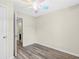Empty bedroom with laminate flooring and adjoining bathroom at 5357 Beaver Br, Norcross, GA 30071