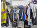 Walk-in closet with wire shelving and lots of clothes hanging at 5357 Beaver Br, Norcross, GA 30071
