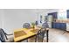 Eat-in kitchen with stainless appliances, blue cabinets, and a modern table, perfect for dining at 5357 Beaver Br, Norcross, GA 30071