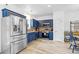 Modern kitchen with stainless steel appliances, ample cabinet space and hardwood flooring at 5357 Beaver Br, Norcross, GA 30071