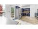 Bright kitchen boasts stainless steel appliances, blue cabinets, and hardwood floors at 5357 Beaver Br, Norcross, GA 30071