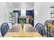 Eat-in kitchen with blue cabinets, stainless steel appliances, and a cozy eat-in dining area at 5357 Beaver Br, Norcross, GA 30071