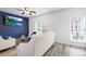 Bright living room with a decorative blue accent wall and natural light at 5357 Beaver Br, Norcross, GA 30071