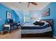 Cozy bedroom with desk, a ceiling fan, a bed with blue and white bedding at 212 Warrenton Dr, Douglasville, GA 30134