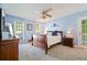 Serene bedroom with natural lighting, ceiling fan, and cozy décor at 212 Warrenton Dr, Douglasville, GA 30134