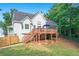 Backyard with a large deck, screened in porch, and lush lawn at 212 Warrenton Dr, Douglasville, GA 30134