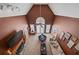 High-ceiling living room showcasing fireplace, ceiling fan, and cozy seating area at 212 Warrenton Dr, Douglasville, GA 30134