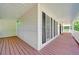 Inviting front porch featuring a red wooden floor and white railings, offering a welcoming entrance at 212 Warrenton Dr, Douglasville, GA 30134