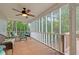 Comfortable screened porch with ceiling fan and wooded views perfect for relaxing outdoors at 212 Warrenton Dr, Douglasville, GA 30134