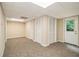 Finished basement featuring carpet, neutral walls, and access to the outdoors at 2120 Glenwood Downs Dr, Decatur, GA 30035