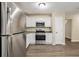 Kitchen featuring stainless steel appliances, granite countertops, modern cabinetry, and hardwood floors at 2120 Glenwood Downs Dr, Decatur, GA 30035