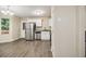 Eat in kitchen featuring stainless steel appliances, granite countertops, modern cabinetry, and hardwood floors at 2120 Glenwood Downs Dr, Decatur, GA 30035