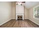 Inviting living room features a fireplace, hardwood floors, recessed lighting, and vaulted ceilings at 2120 Glenwood Downs Dr, Decatur, GA 30035