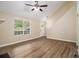 Bright living room featuring hardwood floors, neutral walls, vaulted ceilings and a ceiling fan at 2120 Glenwood Downs Dr, Decatur, GA 30035