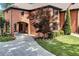 View of the exterior brick home featuring an attached two-car garage and mature landscaping at 5121 Hunters Hill Sw Cv, Lilburn, GA 30047