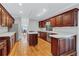 Spacious kitchen with wood cabinets, stainless steel appliances, and a center island at 5121 Hunters Hill Sw Cv, Lilburn, GA 30047