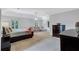 Spacious main bedroom featuring a sitting area, carpet and multiple windows at 5121 Hunters Hill Sw Cv, Lilburn, GA 30047