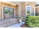 Charming front entrance with double doors, a brick walkway and stone and brick facade at 8240 Hurakan Creek Xing, Cumming, GA 30028
