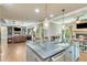 Open-concept kitchen with granite counters overlooking the living area at 8240 Hurakan Creek Xing, Cumming, GA 30028