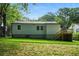 Backyard featuring grass and a small deck at 1227 Kenilworth Dr, Atlanta, GA 30310