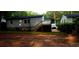 Backyard with freshly laid sod and a view of the back of the house with a wooden deck at 1227 Kenilworth Dr, Atlanta, GA 30310