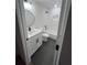Well-lit bathroom featuring black fixtures, modern vanity, and a shower-tub combination with tiled walls at 1227 Kenilworth Dr, Atlanta, GA 30310