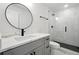 Modern bathroom featuring a glass-enclosed shower, sleek fixtures, and a vanity with stylish hardware at 1227 Kenilworth Dr, Atlanta, GA 30310