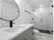 Modern bathroom featuring a glass-enclosed shower, sleek fixtures, and a vanity with stylish hardware at 1227 Kenilworth Dr, Atlanta, GA 30310