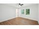 A bright bedroom with hardwood floors, a ceiling fan, and a double hung window at 1227 Kenilworth Dr, Atlanta, GA 30310