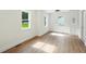 Bright bedroom with hardwood floors, recessed lighting, and large double hung windows at 1227 Kenilworth Dr, Atlanta, GA 30310