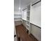 Well-organized walk-in closet featuring built-in shelving and hanging rods at 1227 Kenilworth Dr, Atlanta, GA 30310