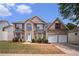 Traditional two-story brick home featuring a two-car garage and manicured front lawn at 3740 Arminto Dr, Ellenwood, GA 30294