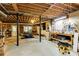 Unfinished basement area with work tables, gym and storage at 8480 Valemont Dr, Sandy Springs, GA 30350