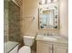 Cozy bathroom featuring a glass-enclosed shower and a vanity with a granite countertop at 8480 Valemont Dr, Sandy Springs, GA 30350