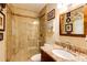 Elegant bathroom featuring a glass shower, a granite sink, and artwork at 8480 Valemont Dr, Sandy Springs, GA 30350