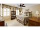 Comfortable bedroom with neutral tones, shuttered windows, and a ceiling fan at 8480 Valemont Dr, Sandy Springs, GA 30350
