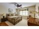 Cozy bedroom with a metal bed frame, built-in window seat, and traditional furnishings at 8480 Valemont Dr, Sandy Springs, GA 30350