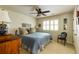 Bright bedroom with a ceiling fan, window shutters, and a charming chair at 8480 Valemont Dr, Sandy Springs, GA 30350