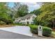 Charming two-story home with manicured landscaping and circular drive at 8480 Valemont Dr, Sandy Springs, GA 30350