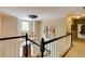 Bright hallway with dark trim and stairs, light walls, and a decorative light fixture at 8480 Valemont Dr, Sandy Springs, GA 30350