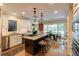 Spacious kitchen with white cabinets, granite countertops, stainless steel appliances and a center island at 8480 Valemont Dr, Sandy Springs, GA 30350