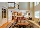 Comfortable living room featuring hardwood floors, built-in shelving, and stylish decor at 8480 Valemont Dr, Sandy Springs, GA 30350