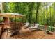 Brick patio with outdoor furniture provides a relaxing space surrounded by nature at 8480 Valemont Dr, Sandy Springs, GA 30350