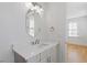 Bathroom featuring a vanity with a stylish mirror, sink and storage at 915 Laurel Brooke Ave, Peachtree City, GA 30269