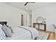 Bright and airy bedroom features hardwood floors and neutral colors at 915 Laurel Brooke Ave, Peachtree City, GA 30269