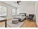 Cozy bedroom features lots of natural light and neutral decor at 915 Laurel Brooke Ave, Peachtree City, GA 30269