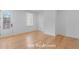 Open and bright fourth bedroom with wood floors, and a glass door at 915 Laurel Brooke Ave, Peachtree City, GA 30269