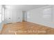 Bright bedroom with wood floors, multiple windows, and closet doors at 915 Laurel Brooke Ave, Peachtree City, GA 30269