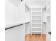Spacious walk-in closet with custom shelving at 915 Laurel Brooke Ave, Peachtree City, GA 30269